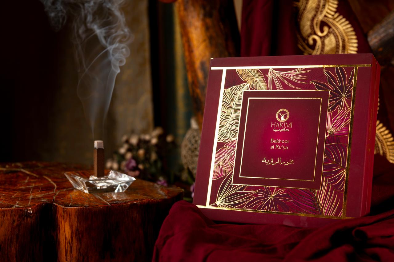 Red and gold box with intricate designs on a dark background