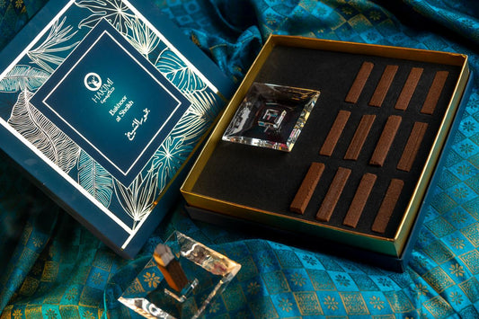 Ceramic items and a box on a blue fabric background