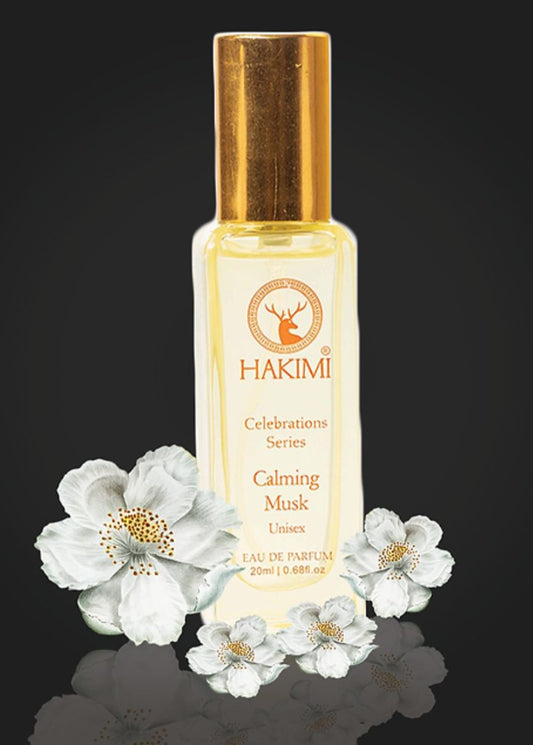Hakimi Calming Musk perfume bottle with flowers on a dark background