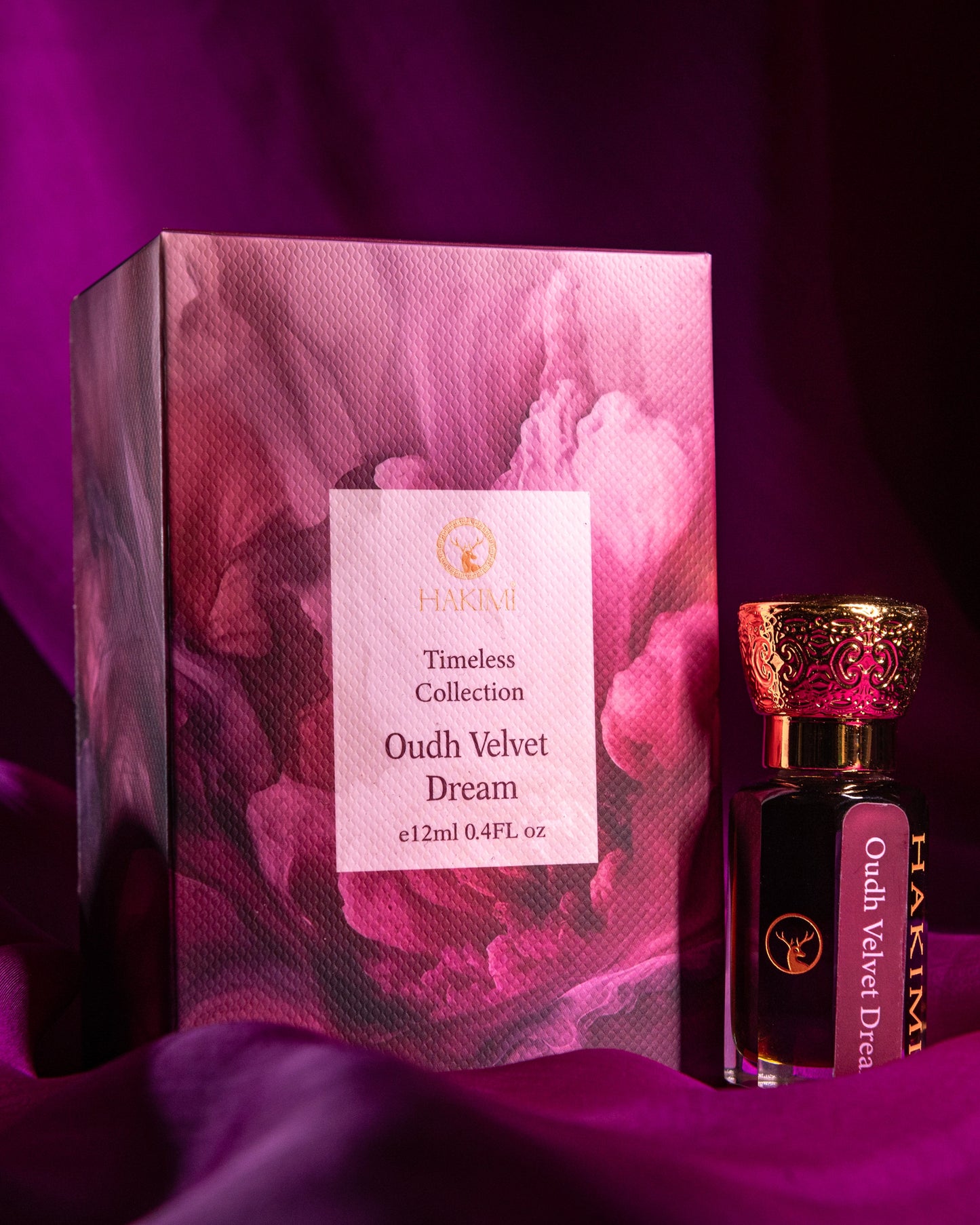 Perfume bottle and packaging of Oudh Velvet Dream on a purple fabric background