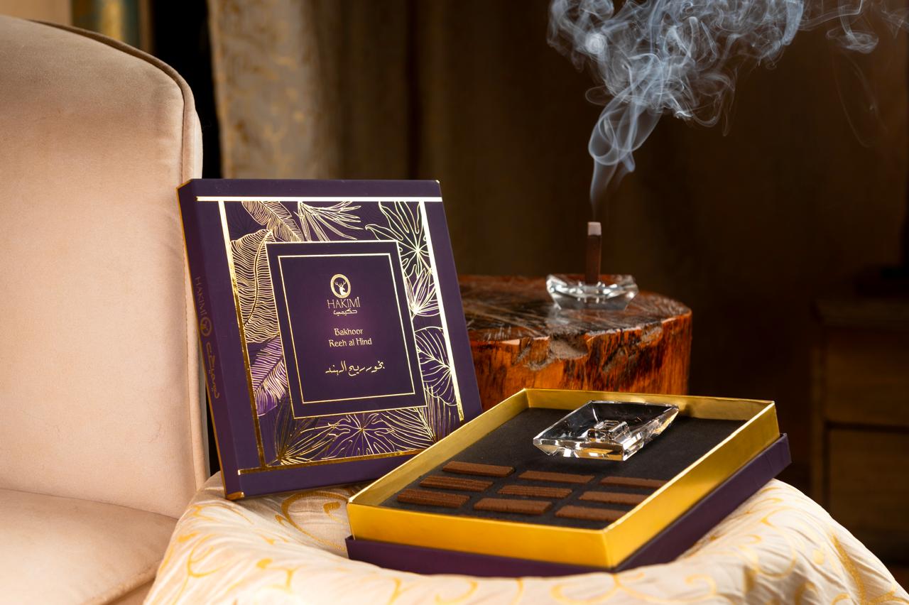 Luxury chocolate set with a decorative box on a table, with a blurred background