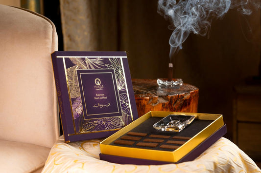 Luxury chocolate set with a decorative box on a table, with a blurred background