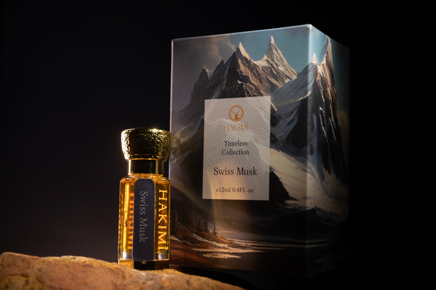 Hakimi Swiss Musk perfume bottle and packaging with mountain design on a dark background