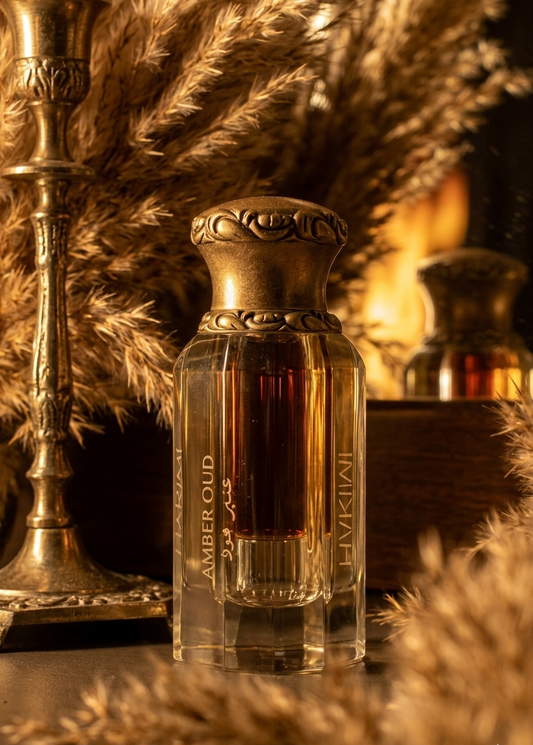 Amber Oud perfume bottle with decorative elements on a warm-toned background