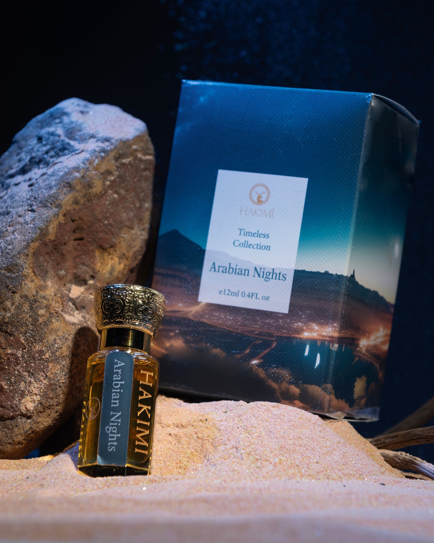 Perfume bottle and packaging on a sandy surface with a dark background