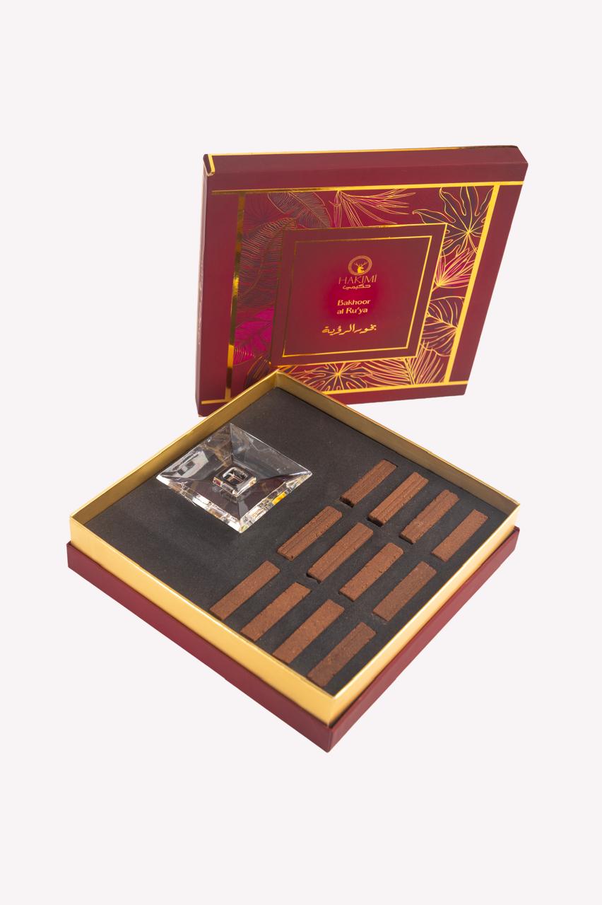 Luxury chocolate set in an ornate red and gold box on a white background