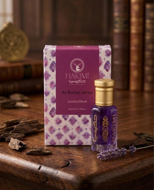 Hakimi Al-Bustan Series Lumani Musk packaging and bottle on a wooden surface with dried herbs.