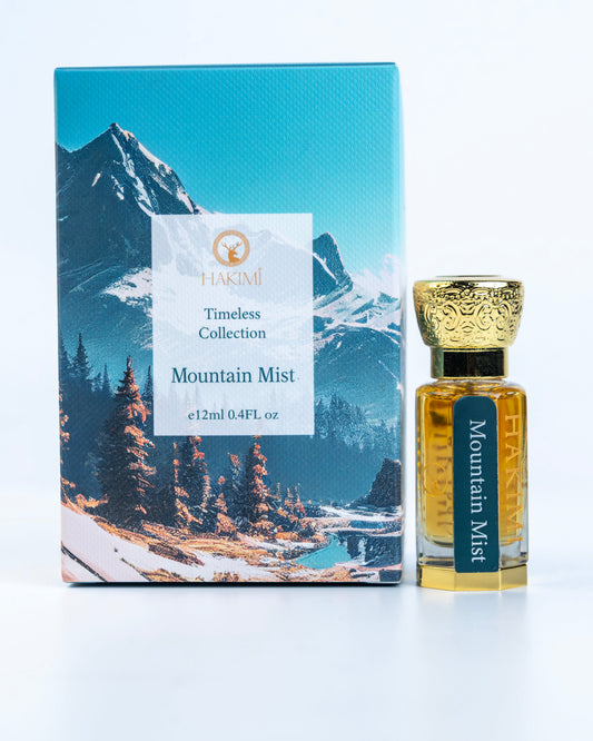 Perfume bottle labeled 'Mountain Mist' with packaging featuring a mountain scene on a white background