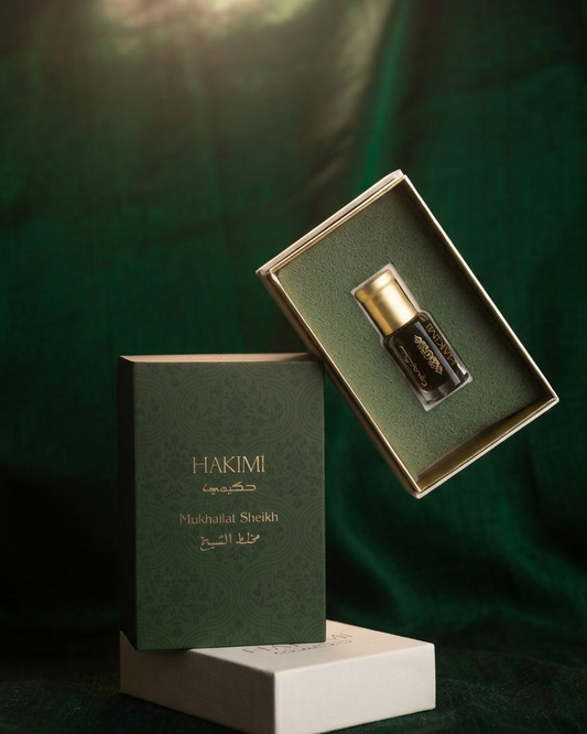 Hakimi perfume bottle in an open box on a dark green background