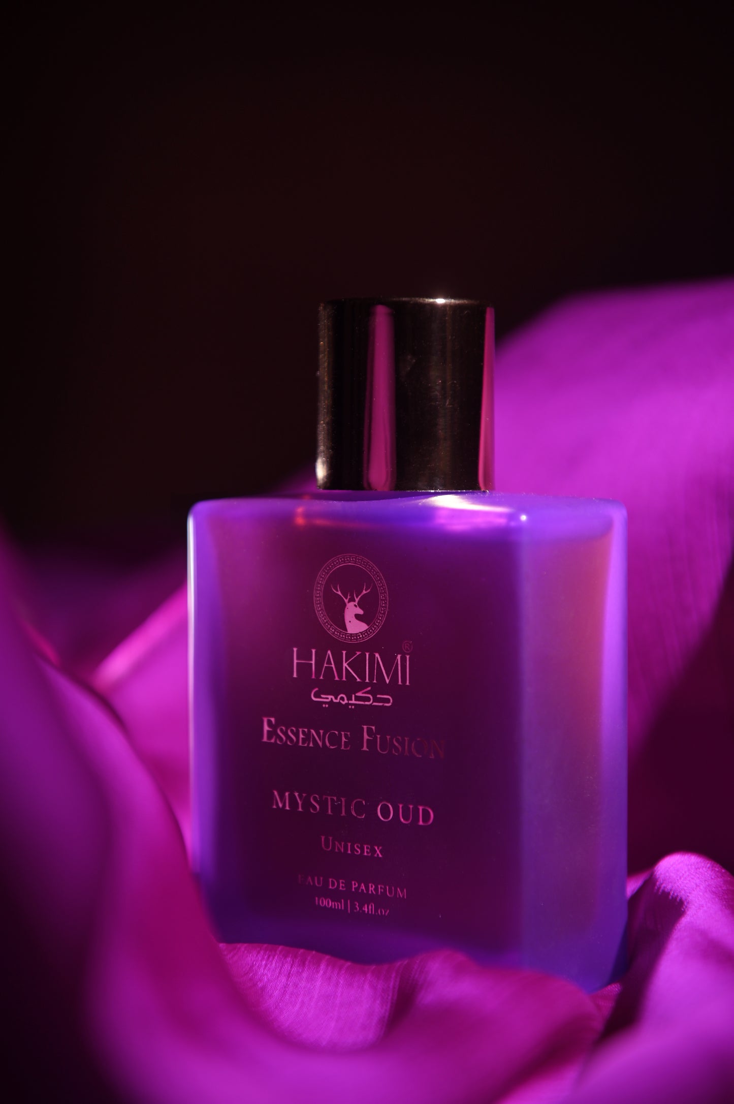 Perfume bottle labeled 'Hakimi' with a purple hue on a dark background