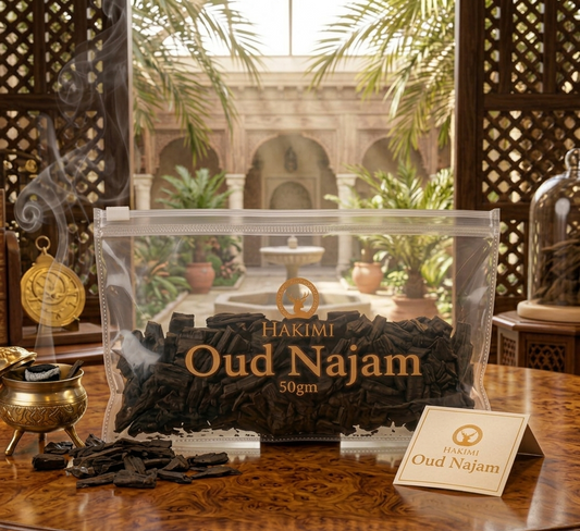 Hakimi Oud Najam incense packaging on a wooden table with a decorative background