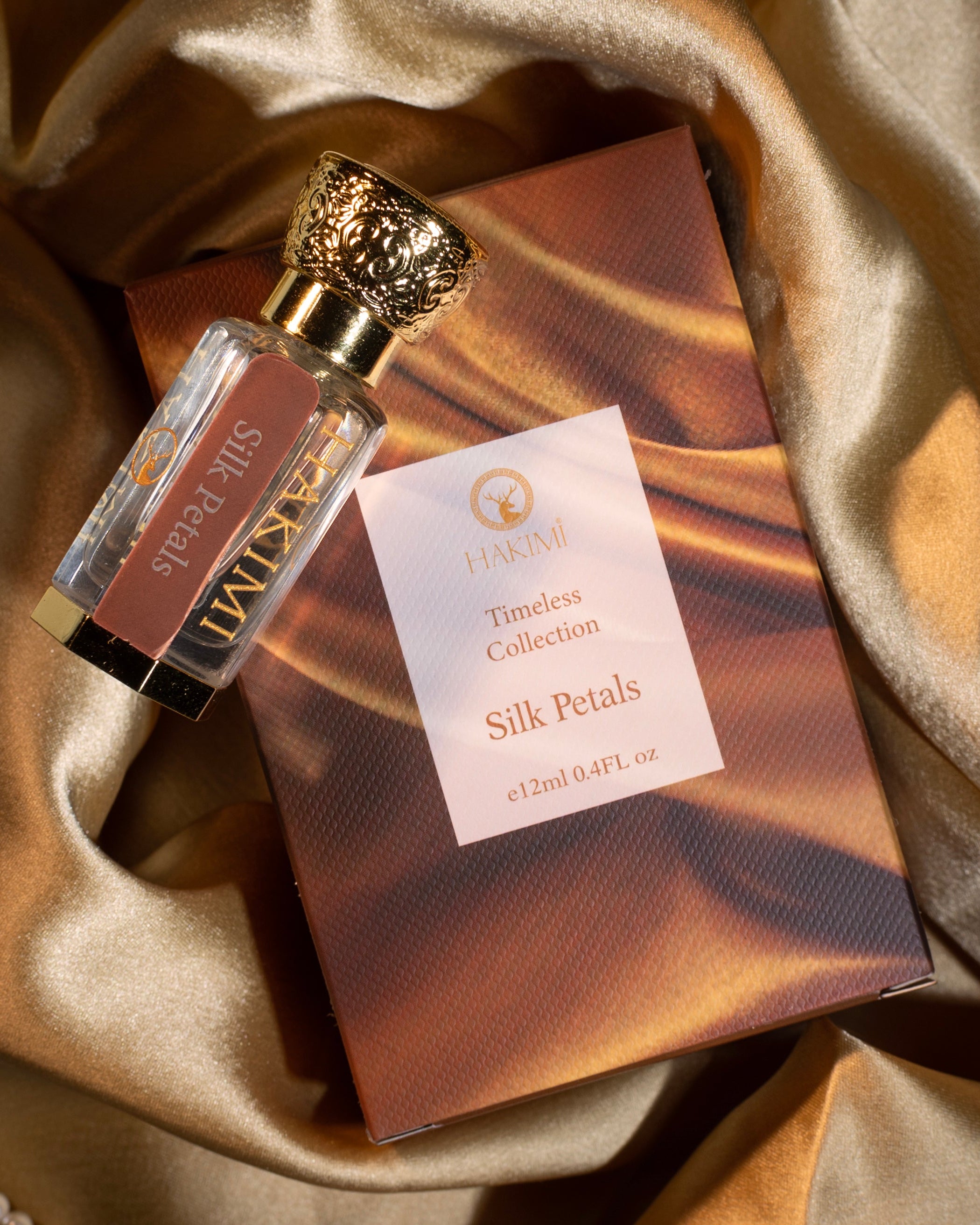 Perfume bottle and packaging on a textured fabric background