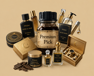 A curated collection of premium perfume and fragrance products arranged on a warm beige background. The set includes several black-and-gold bottles and boxes, a central amber glass jar labeled 'Premium Pick,' a small clear bottle, a round tin, and an open gold presentation box with cylindrical pieces inside.